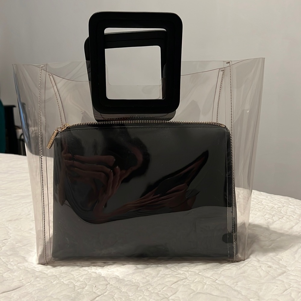 Staud Shirley PVC tote w/removable case. 
• Length 14 1/2” Height 10 1/2”